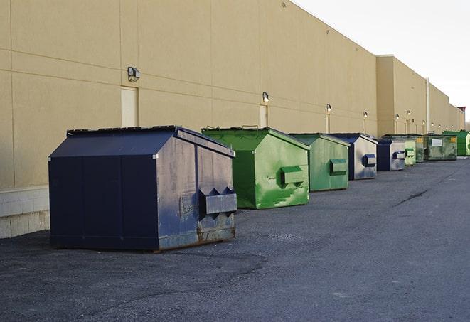 an assortment of sturdy and reliable waste containers near a construction area in Aransas Pass, TX